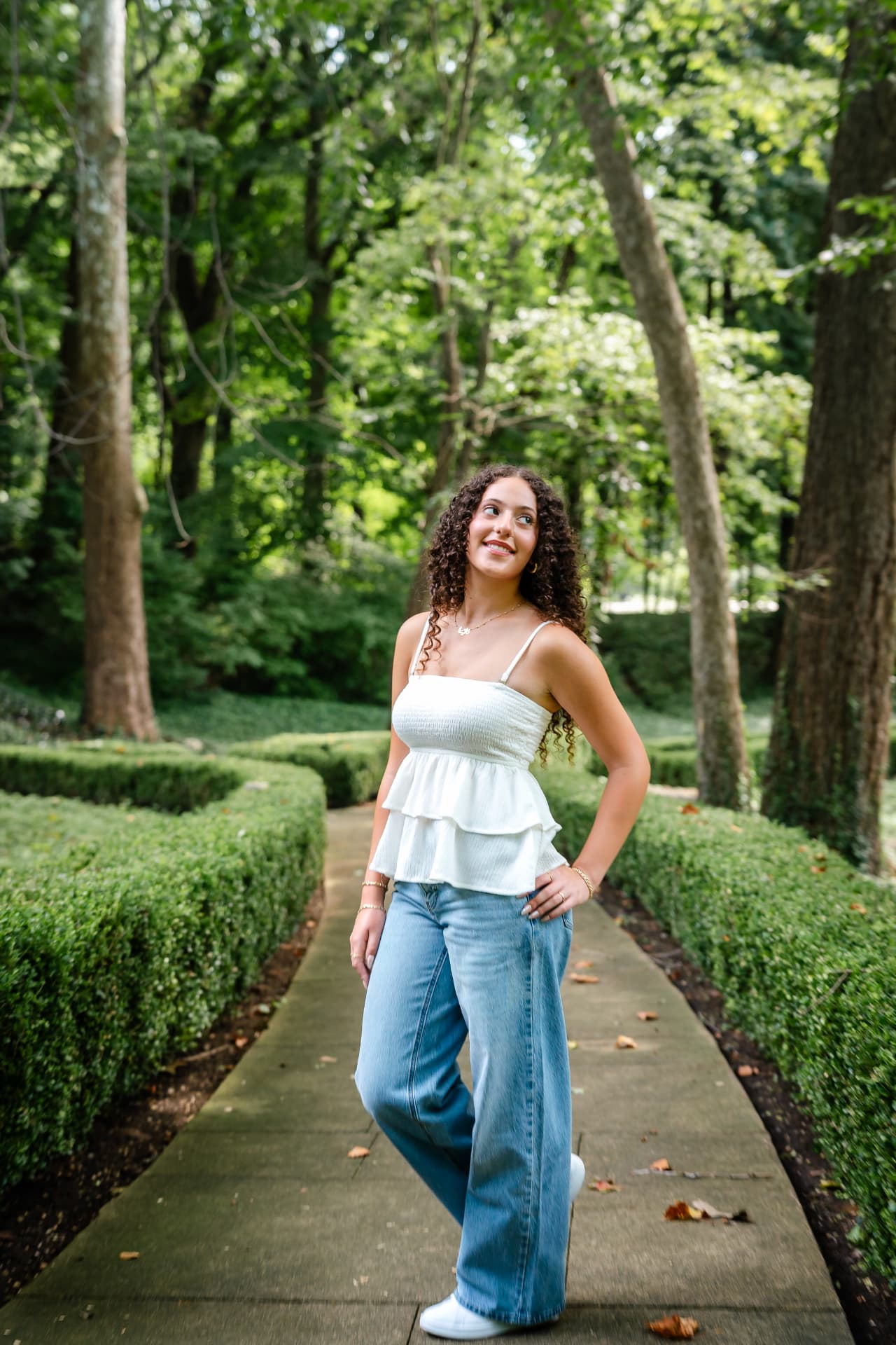 Naya photographed along a garden pathway during her Cleveland senior session