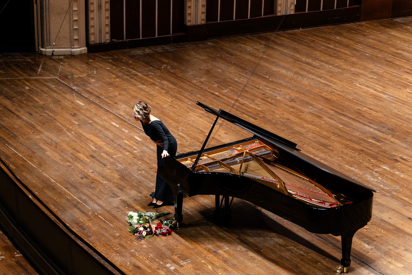Deep bow toward the Severance Music Center audience with flowers at her feet